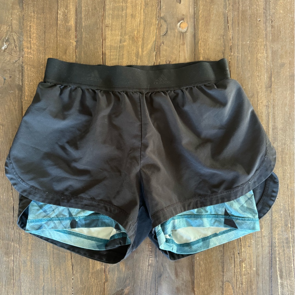 Adidas Running shorts with comfortable layering and blue detials.
